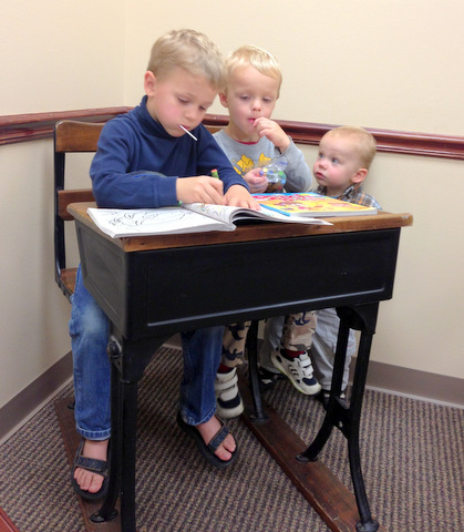 Huss Brothers at Desk